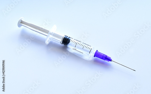 Medical syringe with a needle. Epidemic. Blood collection and injection concept