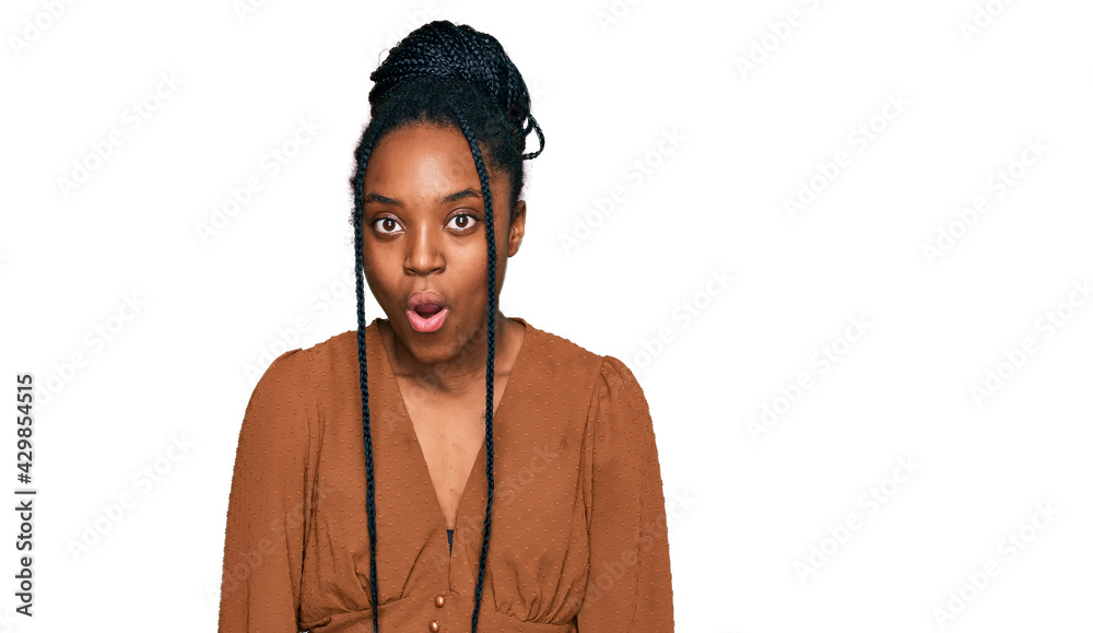 Young african american woman wearing casual clothes afraid and shocked with surprise expression, fear and excited face. Young african american woman wearing casual clothes afraid and shocked with surprise expression, fear and excited face.