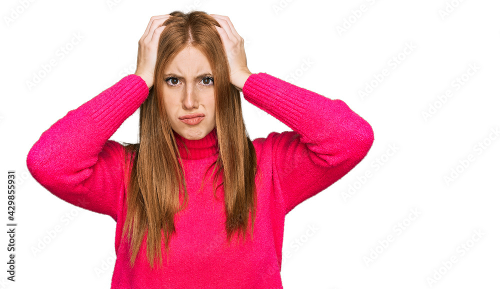 Young irish woman wearing casual clothes suffering from headache desperate and stressed because pain and migraine. hands on head. Young irish woman wearing casual clothes suffering from headache desperate and stressed because pain and migraine. hands on head.