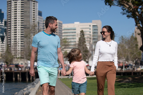 Family in the city. Family walking in urban park.