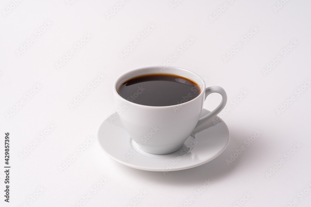 Black coffee in a white cup top view isolated on white background. Black coffee in a white cup top view isolated on white background.