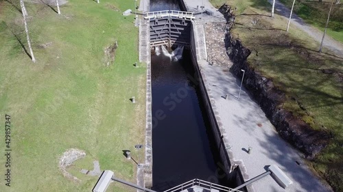 Aerial view of canal with several dams photo