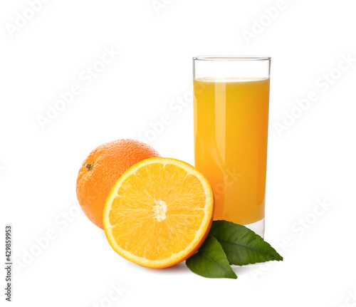 Orange juice, fresh fruits and green leaves on white background