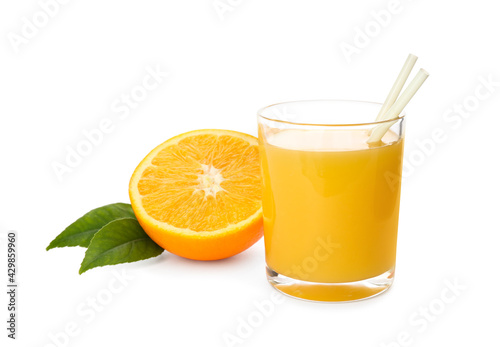 Orange juice, fruit and green leaves on white background