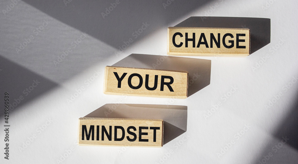 CHANGE YOUR MINDSET written on wooden blocks and white background. Motivation, positive wishes, business, finance, education concept CHANGE YOUR MINDSET written on wooden blocks and white background. Motivation, positive wishes, business, finance, education concept