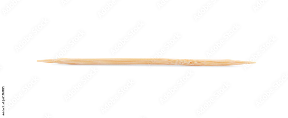 Obraz premium One disposable wooden toothpick on white background