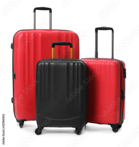 Modern suitcases for travelling on white background