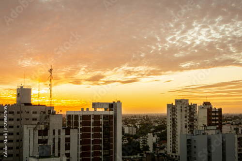 The sun goes down in city