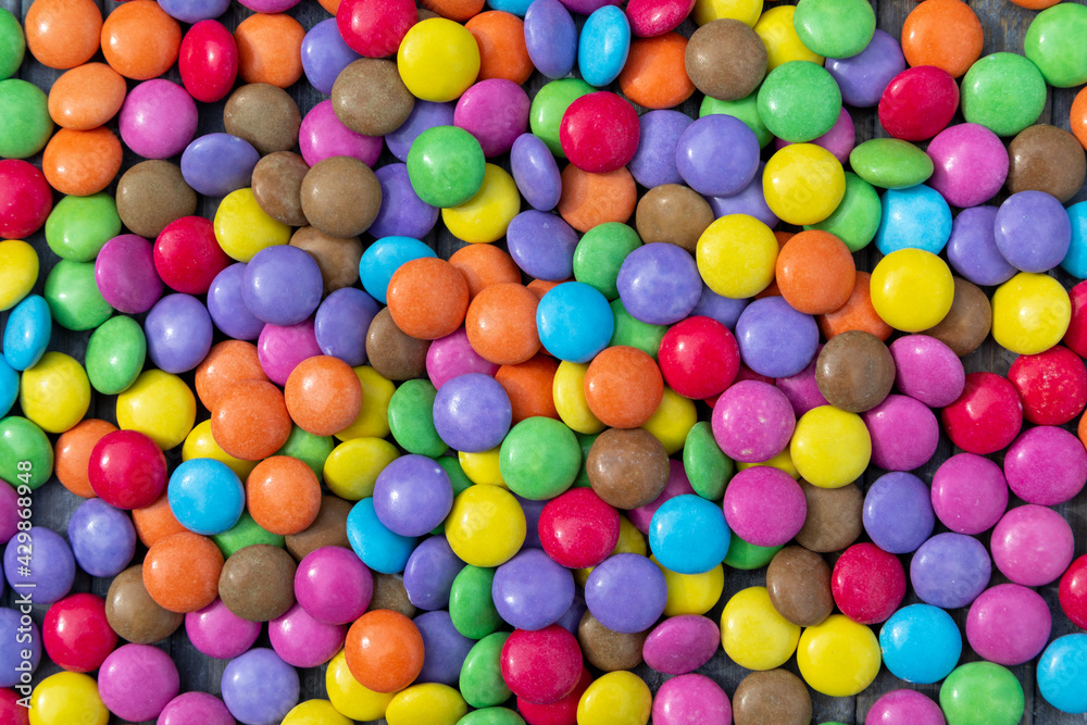 A background of colourful round candies A background of colourful round candies