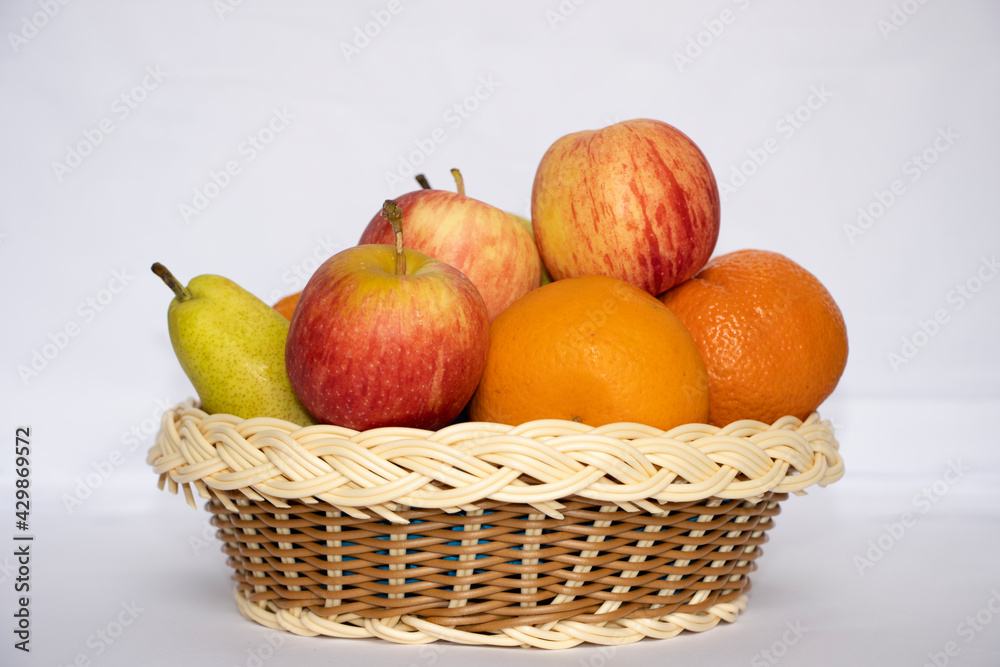 Beautiful Fruits In The Basket In White Isolated Background
