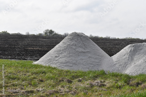 Canvas-taulu Pile of Lime in a Farm Field