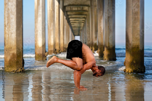 Yoga Afro-American Male Instructor in Crow Pose