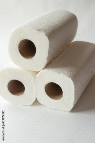 rolls of paper towels, napkins on a white background. White on white, pulp, paper, hygiene. The concept of conscious consumption, sustainable lifestyle. High quality photo