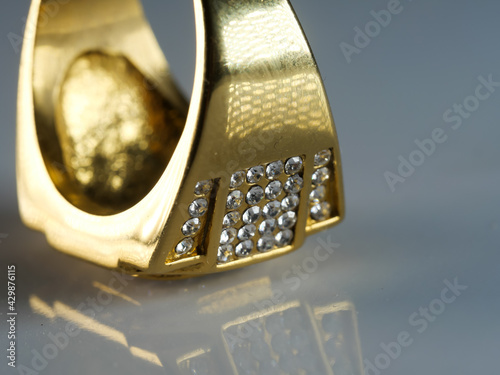 Closeup shot of a men's ring encrusted with diamonds isolated on a white surface photo