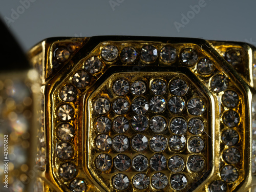 Closeup shot of a men's ring encrusted with diamonds isolated on a white surface photo