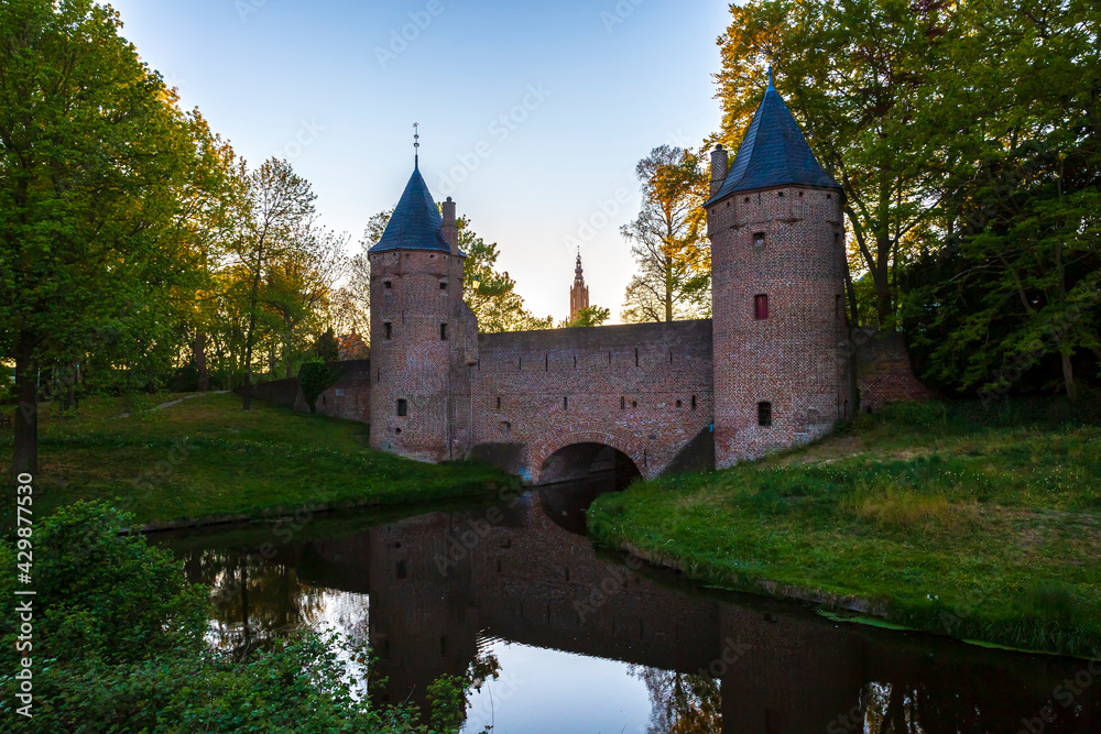 Old water gate Monnikendam in Amersfoort city. Two towers are connected to an arch gate.