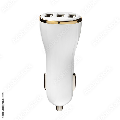 Car charger for mobile phone or smartphone. Connector for a cable for a USB port. Plugs into the car's cigarette lighter. White