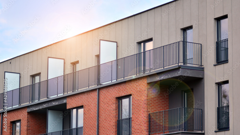 Architectural details of modern apartment building. Modern european residential apartment building complex with sunlight. Architectural details of modern apartment building. Modern european residential apartment building complex with sunlight.