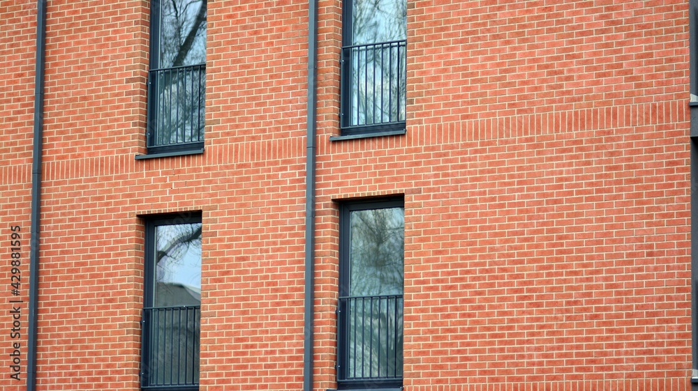 Architectural details of modern apartment building. Modern european residential apartment building complex with sunlight.