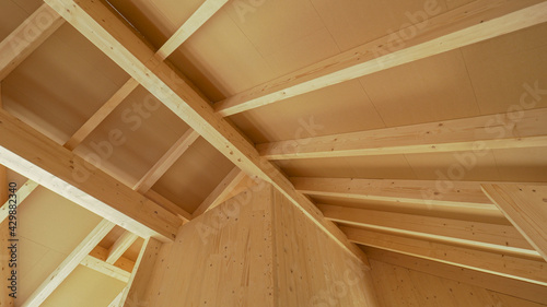 Beautiful view of the ceiling beams of a modern cross laminated timber house.