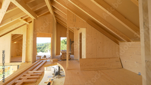 Tableau sur toile CLOSE UP: View of beautiful unfinished interior of a prefabricated lumber house