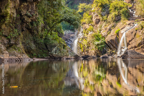 Sao Miguel waterfall with rocks, trees and plants