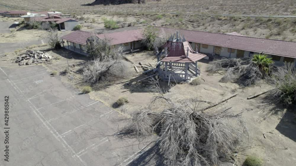 Abandoned vacation resort hotel building with gazebo at Lake Mead Boulder City Las Vegas Nevada desert aerial drone 4k ungraded flat log raw dlog footage