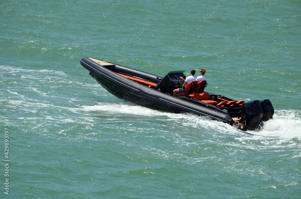 Fototapeta premium High-end pontoon motor boat powered by two outboard engines .
