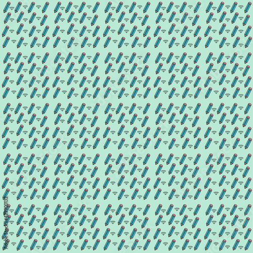 Seamless pattern with pencils on green background