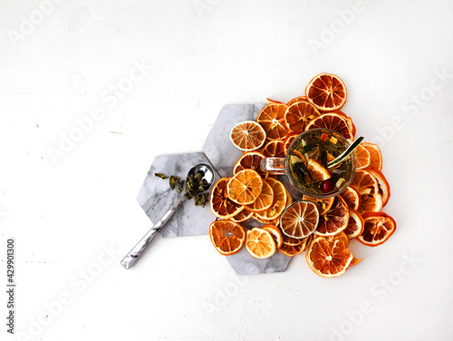 dried fruit in a jar and on the table. vegetarianism and healthy eating. energy for all time from healthy food. beautiful fruits in jars. weight loss. orange white glass. High quality photo