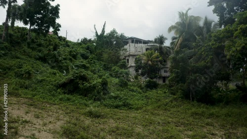 Pulling Away Downhill from a Mansion on a Hill in Jamaica