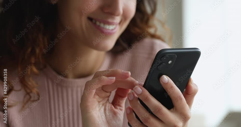Close up female hands holding smartphone using mobile application, e-commerce client, e-shopping and user of electronic commercial retail services. Modern technology usage for fun, work, hobby concept