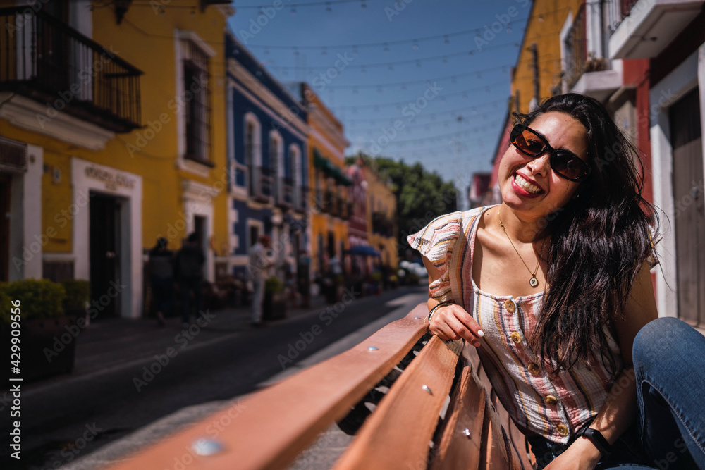 portrait of happy latina smiling at camera