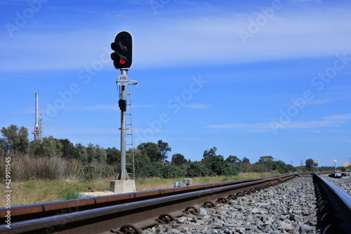 Railway signal on a rail way track photo