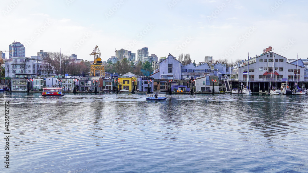 Colourful Boat houses and ferries in the city creek 