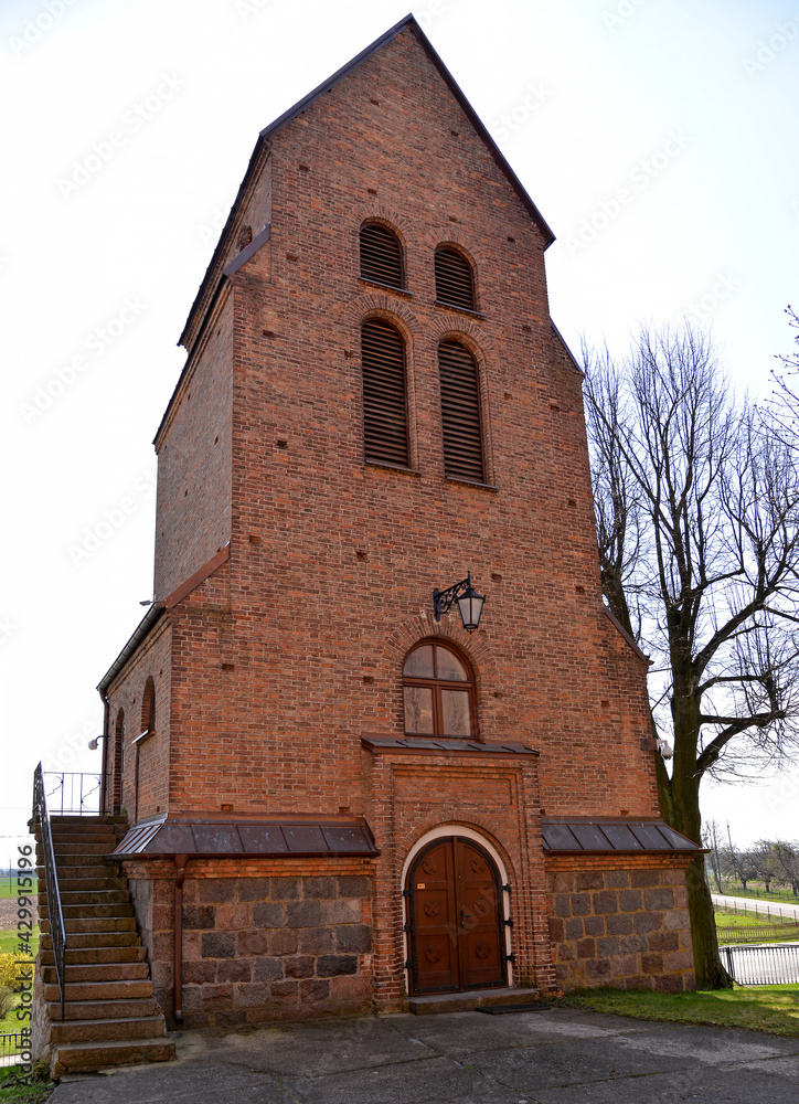 Fototapeta premium Photographs of the belfry of the Catholic Church of Saint Achatius in Czernice Borowe in Masovia, Poland.