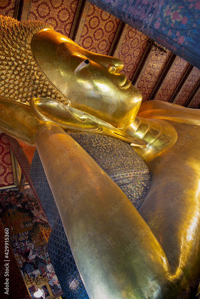 Bangkok, Thailand - January 19, 2019: lying buddha in Wat Pho temple. Royal Grand Palace  in Bangkok 