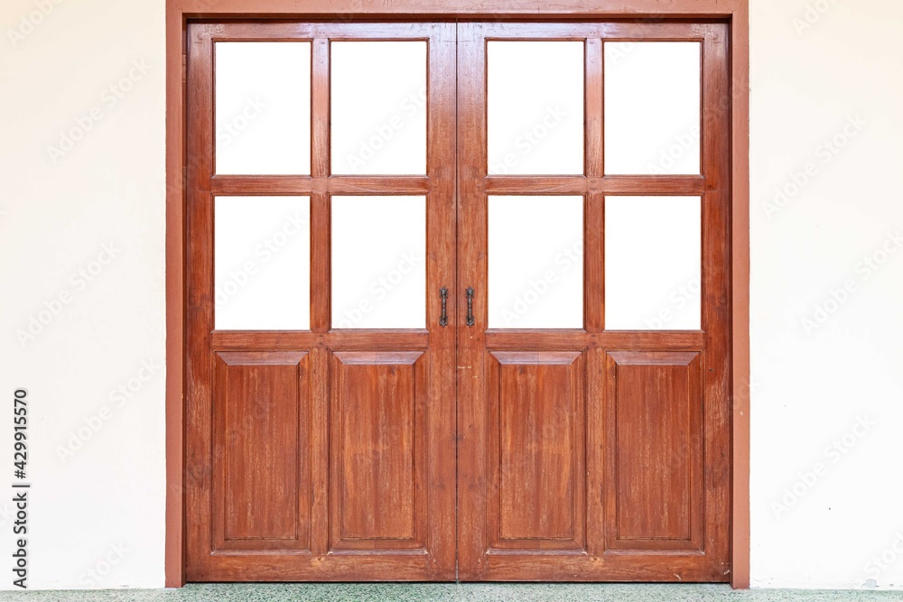 Obraz premium Large teak wood door frame isolated on a white background