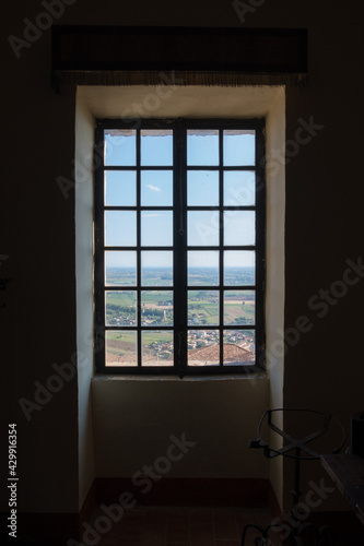 Old vintage window on an ancient facade. No people