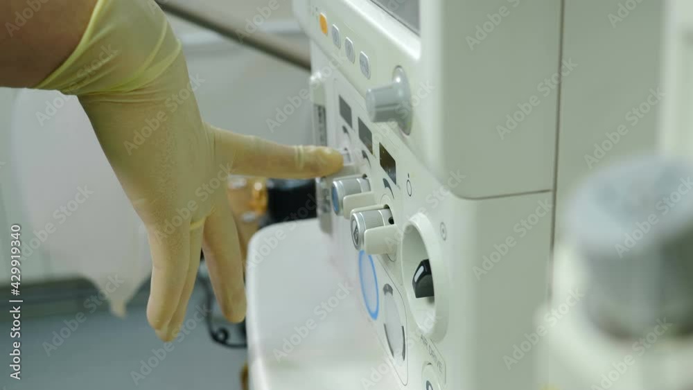 Medical worker adjusting and tuning artificial lung ventilation equipment in surgery. ventilator breathing system. Life support equipment. Pneumonia and tuberculosis, Covid-19. 4 k video Medical worker adjusting and tuning artificial lung ventilation equipment in surgery. ventilator breathing system. Life support equipment. Pneumonia and tuberculosis, Covid-19. 4 k video