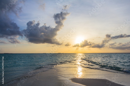 the Indian Ocean in the Maldives islands in the evening at sunset