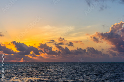 the Indian Ocean in the Maldives islands in the evening at sunset