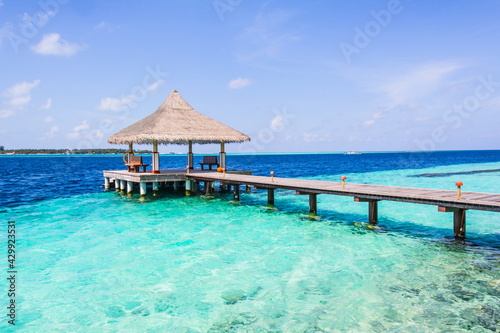 Wooden pier on a tropical beach in the Maldives