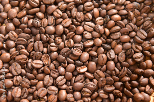Coffee composition.Coffee beans after roasting.Coffee beans and ground powder on stone background.selective focus