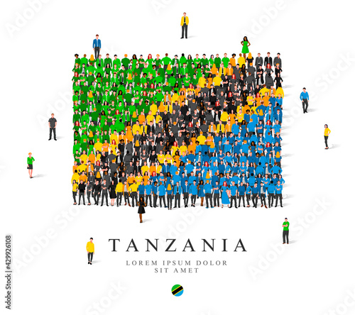 A large group of people are standing in green, yellow, black and blue robes, symbolizing the flag of Tanzania.