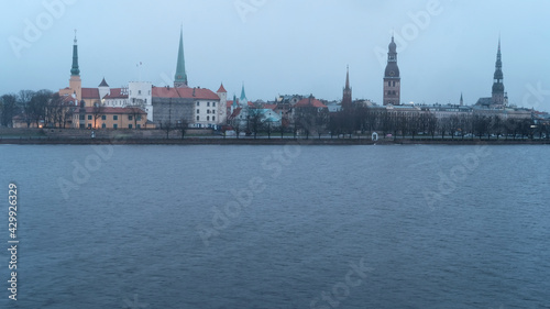 Dawn over Riga, snow falls in spring