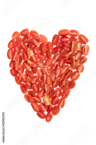 tomatoes cherry on a table as a heart form isolated on white background 