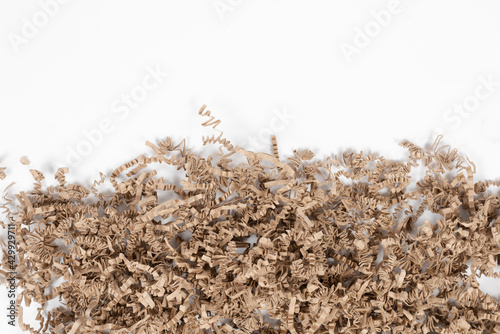 packing wood shavings chips on white background, carton, recycled 