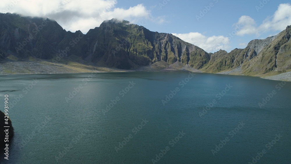 Obraz premium Crater lake of the volcano Pinatubo among the mountains, Philippines, Luzon. Aerial view beautiful landscape at Pinatubo mountain crater lake. Travel concept