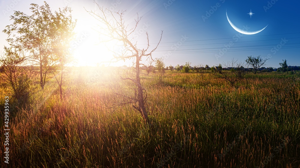 Ramadan background . Crescent moon with beautiful sunset background
